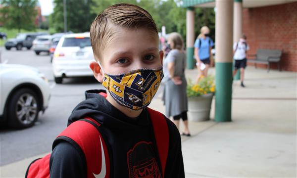 student smiles on first day of school
